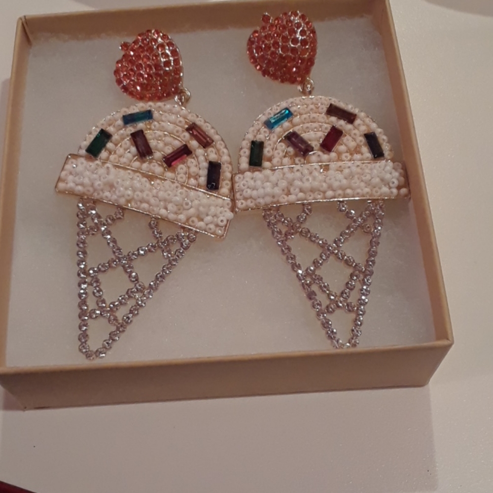 Lipstick and chrome earrings